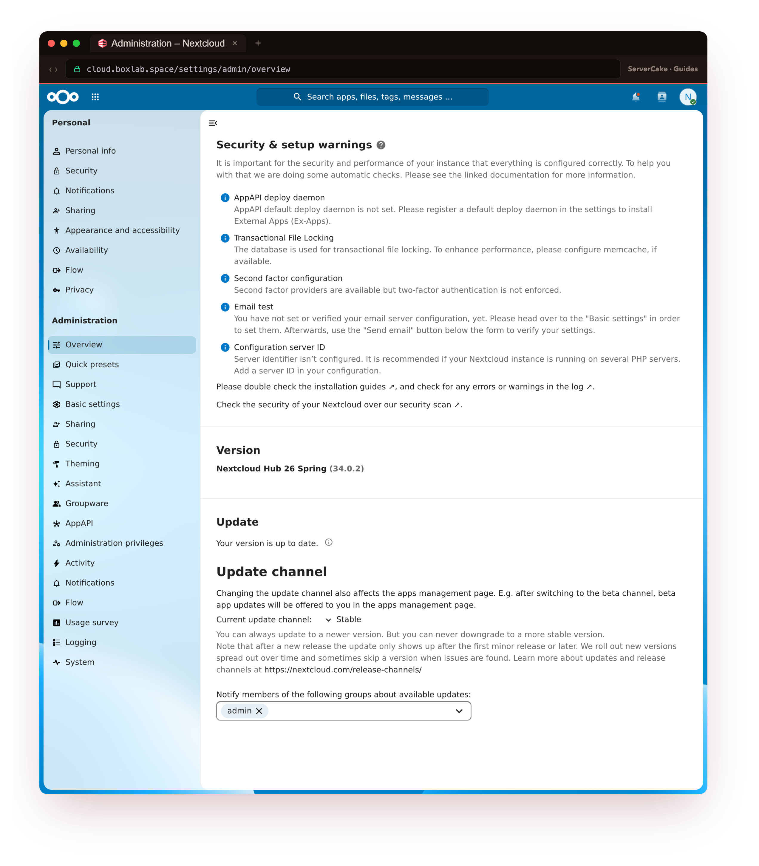 The genuine Nextcloud 34.0.2 admin overview at cloud.boxlab.space, the Security and setup warnings section with no errors and no warnings remaining after the recommended settings were applied, only optional informational notes, and the version panel showing 34.0.2 up to date